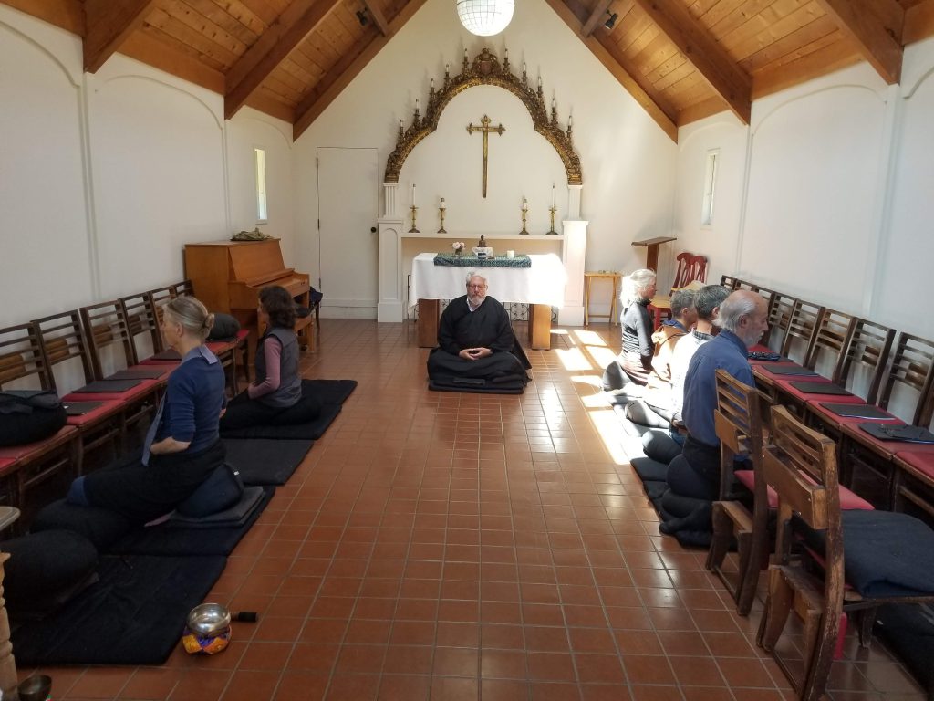 Seven Soto Zen Buddhist practitioners sit zazen in St. Aidan's Episcopal church in Bolinas, CA.